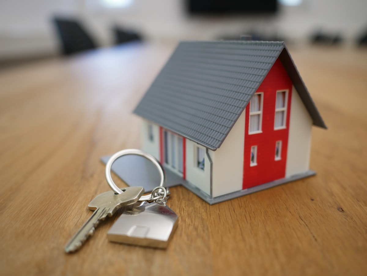 A model house beside a set of keys